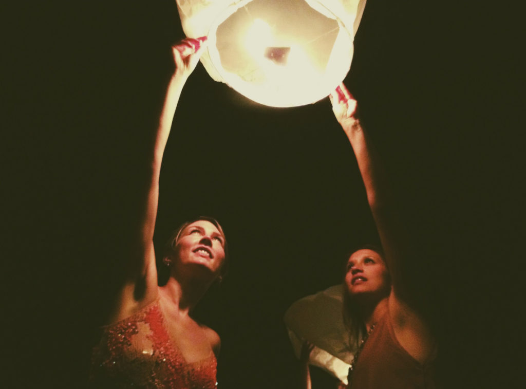 kind people lighting a lantern with happiness.