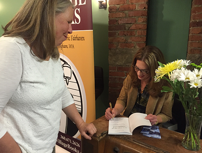 Jan L. Bowen signing her book